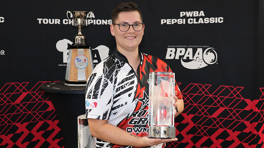 Olivia Farwell holding the 2022 PWBA Rookie of the Year trophy